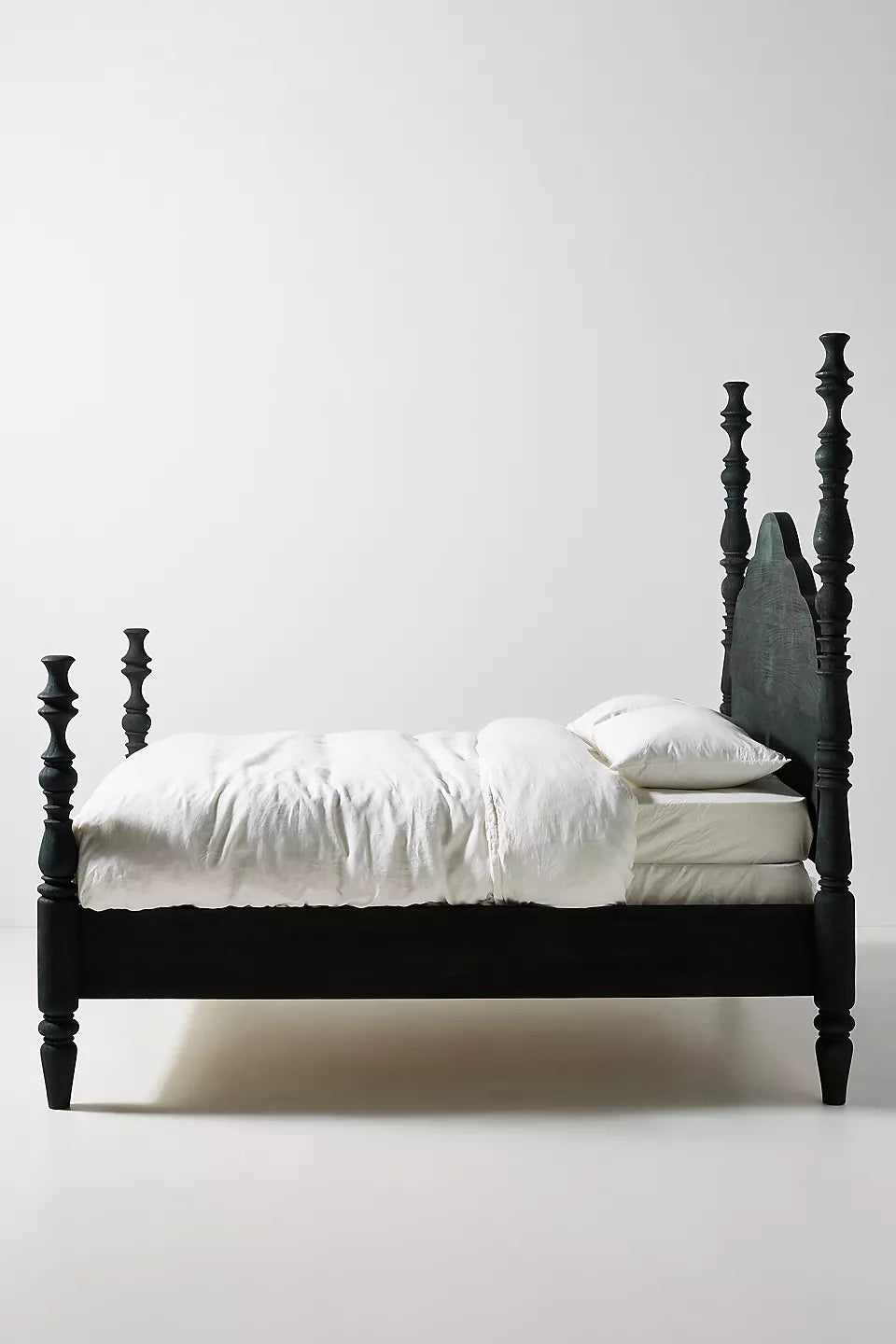 This is a Spindle Four-Poster Bed, featuring intricately turned posts and a classic yet bold design.-hansa handicraft