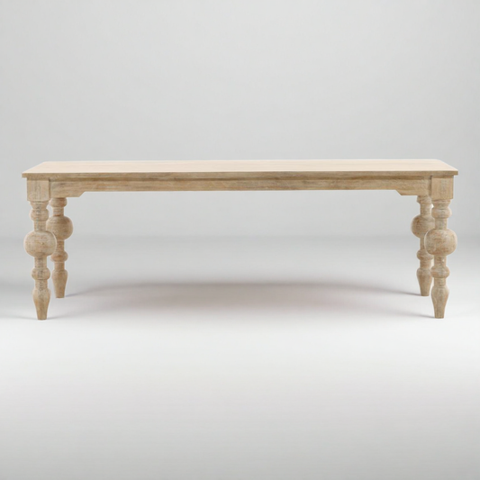 Wooden table with turned legs on a white background