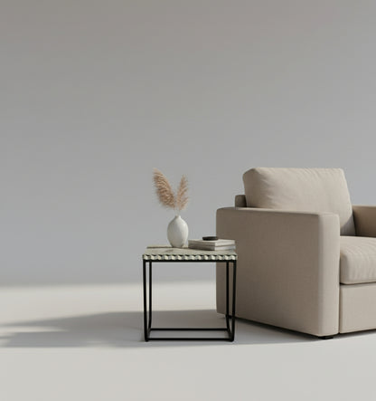 Small side table with a geometric patterned top on a white background