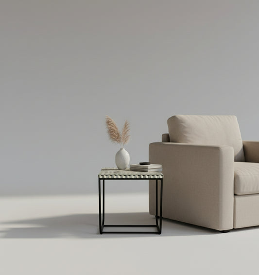 Small side table with a geometric patterned top on a white background