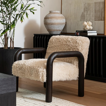Chair with fluffy beige cushion and wooden frame