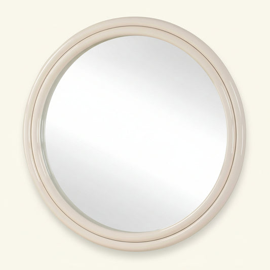 Round mirror with a beige frame on a white background
