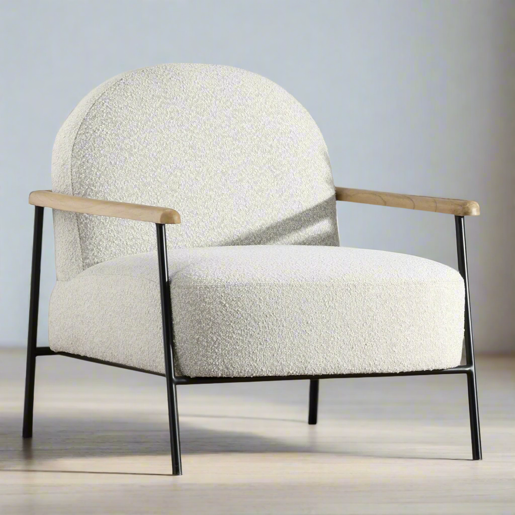 Modern armchair with white textured upholstery and wooden arms on a neutral background